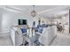 Spacious living room with ample seating, large windows, and contemporary decor at 42210 Lake Timber Dr, Punta Gorda, FL 33982