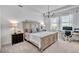 Serene main bedroom with neutral tones and a tray ceiling at 42210 Lake Timber Dr, Punta Gorda, FL 33982