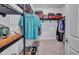 Well-organized walk-in closet with shelving, hanging rods, and ample storage space for clothes and accessories at 42210 Lake Timber Dr, Punta Gorda, FL 33982