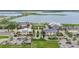 Community aerial showcases commercial area, pool, parking, and well-maintained green spaces at 42239 Lake Timber Dr, Punta Gorda, FL 33982