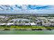 Aerial shot overlooking waterfront homes and a tranquil lake, showcasing a picturesque neighborhood at 42239 Lake Timber Dr, Punta Gorda, FL 33982