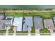 Aerial view of homes with pools, manicured lawns, and waterfront access on a sunny day at 42239 Lake Timber Dr, Punta Gorda, FL 33982