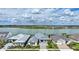 Aerial view of waterfront neighborhood showcasing picturesque homes and a beautiful lake setting at 42239 Lake Timber Dr, Punta Gorda, FL 33982