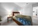 Comfortable bedroom features a leather bed frame, soft carpet, and sliding closet doors at 42239 Lake Timber Dr, Punta Gorda, FL 33982