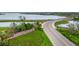 Babcock Ranch entrance with well-maintained landscaping, signage, and a picturesque view of the bridge at 42239 Lake Timber Dr, Punta Gorda, FL 33982