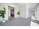 Inviting front porch with white railing, stylish decor, and a view into the home at 42239 Lake Timber Dr, Punta Gorda, FL 33982