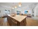 Open concept kitchen with counter seating, stainless appliances, and an adjacent living space at 42239 Lake Timber Dr, Punta Gorda, FL 33982