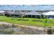 Scenic aerial view of homes with manicured lawns and a tranquil waterfront at 42239 Lake Timber Dr, Punta Gorda, FL 33982