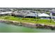 Aerial view of homes with manicured lawns and stunning lakefront views at 42239 Lake Timber Dr, Punta Gorda, FL 33982