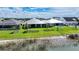Aerial view of beautiful homes with lush green lawns and waterfront vistas at 42239 Lake Timber Dr, Punta Gorda, FL 33982