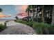 Picturesque outdoor restaurant with a waterfront view, lush landscaping, and a cozy boardwalk at 42239 Lake Timber Dr, Punta Gorda, FL 33982