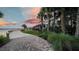 Outdoor restaurant and patio seating overlooking a waterfront view at sunset at 42239 Lake Timber Dr, Punta Gorda, FL 33982