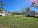 Large backyard with a shed, fence, and small garden at 447 Yeager St, Port Charlotte, FL 33954