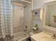 Bright bathroom with a shower-tub combo, decorative accents, and a vanity at 447 Yeager St, Port Charlotte, FL 33954
