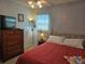 Bedroom with natural light featuring a comfortable queen bed and furniture at 447 Yeager St, Port Charlotte, FL 33954