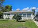 Charming single-story home with a well-maintained lawn and inviting blue front door at 447 Yeager St, Port Charlotte, FL 33954