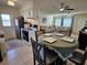 Cozy kitchen with a dining area featuring a table set for four and updated appliances at 447 Yeager St, Port Charlotte, FL 33954