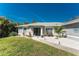 Charming home with meticulously landscaped front yard and elegant entrance; great curb appeal at 4529 Enid Ln, North Port, FL 34288