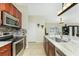 Updated kitchen features stainless steel appliances and sleek countertops and tile backsplash at 4529 Enid Ln, North Port, FL 34288