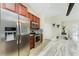 Updated kitchen features stainless steel appliances, custom cabinets, and sleek countertops at 4529 Enid Ln, North Port, FL 34288
