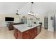 Bright open concept kitchen with stainless steel appliances and large island at 4529 Enid Ln, North Port, FL 34288
