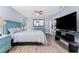 Bright main bedroom with hardwood floors, ceiling fan, and access to the backyard at 4529 Enid Ln, North Port, FL 34288