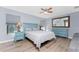 Calming main bedroom with hardwood floors, ceiling fan, and relaxing decor at 4529 Enid Ln, North Port, FL 34288