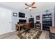 Inviting home office featuring hardwood floors, a ceiling fan, and neutral wall colors at 4529 Enid Ln, North Port, FL 34288
