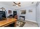 Home office space featuring wood desk and bookshelves, a comfortable leather chair, and a large window at 4529 Enid Ln, North Port, FL 34288