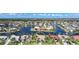 Aerial view of waterfront homes showcasing backyard canals and landscaping in tropical community at 494 Monaco Dr, Punta Gorda, FL 33950