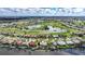 This aerial view showcases waterfront homes with a golf course nearby at 494 Monaco Dr, Punta Gorda, FL 33950