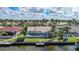 This backyard features a screened-in pool and dock access to a canal at 494 Monaco Dr, Punta Gorda, FL 33950