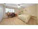 Bright bedroom with tiled floors, ceiling fan, and furniture creating a versatile living space at 494 Monaco Dr, Punta Gorda, FL 33950