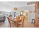 Dining area and kitchen with stainless appliances and dark granite countertops at 494 Monaco Dr, Punta Gorda, FL 33950