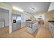 Bright kitchen featuring white cabinetry, stainless steel appliances, and a center island with dark countertops at 494 Monaco Dr, Punta Gorda, FL 33950