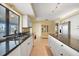 Well-lit kitchen featuring granite countertops, white cabinetry, and stainless steel appliances at 494 Monaco Dr, Punta Gorda, FL 33950