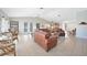 Spacious living room with tile flooring, vaulted ceilings, and a comfortable seating area at 494 Monaco Dr, Punta Gorda, FL 33950