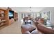 Living room featuring tile floors, a vaulted ceiling and comfortable seating at 494 Monaco Dr, Punta Gorda, FL 33950
