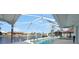 Screened-in pool overlooking a canal, providing a tranquil outdoor space at 494 Monaco Dr, Punta Gorda, FL 33950