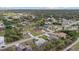 An aerial view of a single-story home in a verdant, residential neighborhood at 5113 Weatherton St, North Port, FL 34288