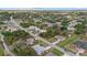 An aerial view of a home in a tree-lined neighborhood at 5113 Weatherton St, North Port, FL 34288