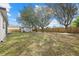 Spacious backyard with large shade trees and a storage shed at 5113 Weatherton St, North Port, FL 34288