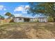 Spacious backyard with large shade trees and shed at 5113 Weatherton St, North Port, FL 34288