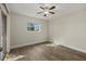 Bedroom featuring neutral walls, a ceiling fan, a window and wood-look flooring at 5113 Weatherton St, North Port, FL 34288
