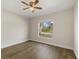 Light, airy bedroom with wood-look floors and a bright window at 5113 Weatherton St, North Port, FL 34288