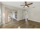 Bedroom featuring wood-look flooring, a ceiling fan and sliding glass doors at 5113 Weatherton St, North Port, FL 34288