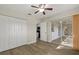 Bedroom with closet, ceiling fan, access to lanai, and wood-look flooring at 5113 Weatherton St, North Port, FL 34288