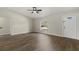 Bright and airy living room with wood flooring and a large window at 5113 Weatherton St, North Port, FL 34288