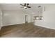 Spacious living room featuring wood floors and a view of the kitchen at 5113 Weatherton St, North Port, FL 34288