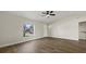 Comfortable living room with wood floors and natural light from window at 5113 Weatherton St, North Port, FL 34288